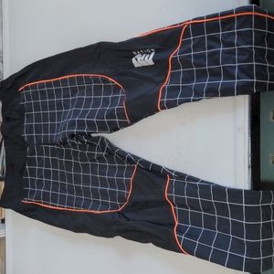 PE Nation black leggings with orange accent